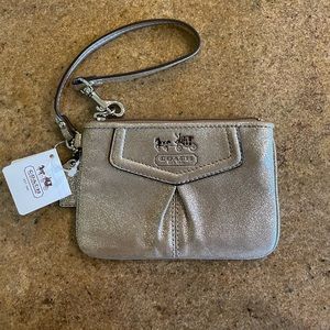 Brand new with tags champagne metallic Coach wristlet